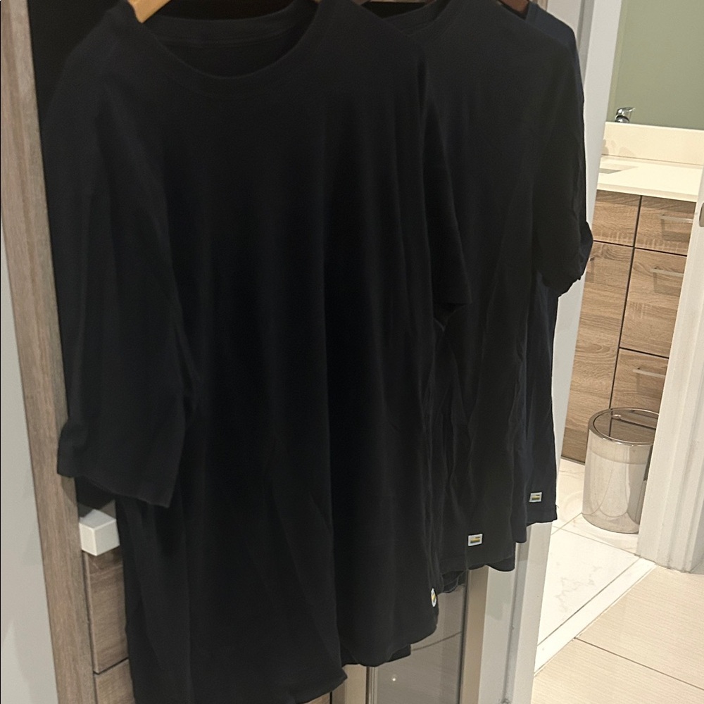 Vuori Black Short Sleeve Tee
Tuvalu Tees set of 3 2 black one blue.